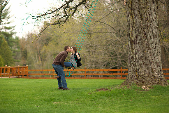 Engagement portrait on a swing at Crooked River Weddings